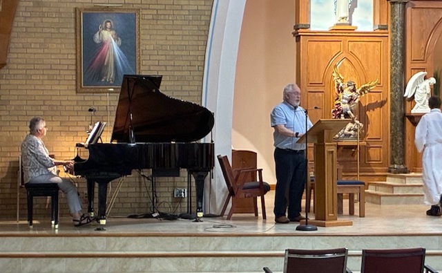 Michael J Murphy singing at a funeral